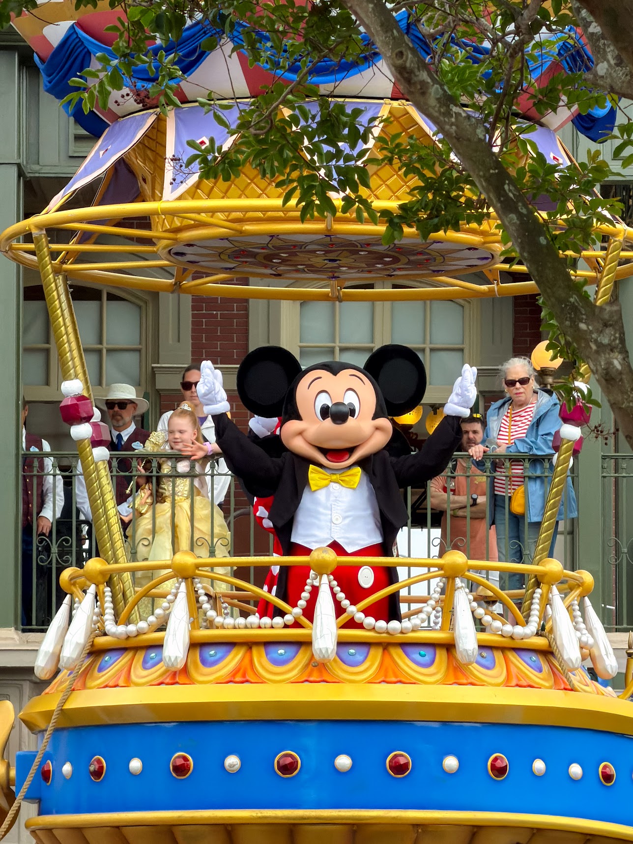 Mickey Mouse waving from a parade float