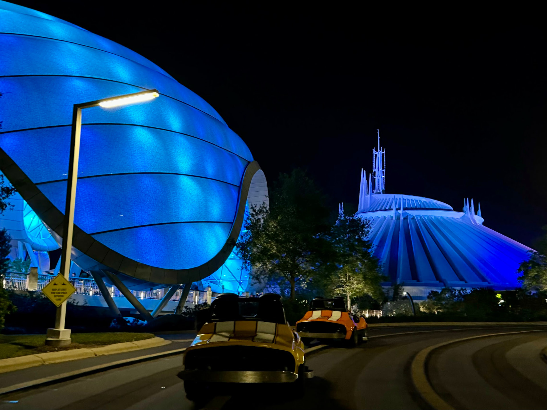 Tomorrowland glowing in blue light at night